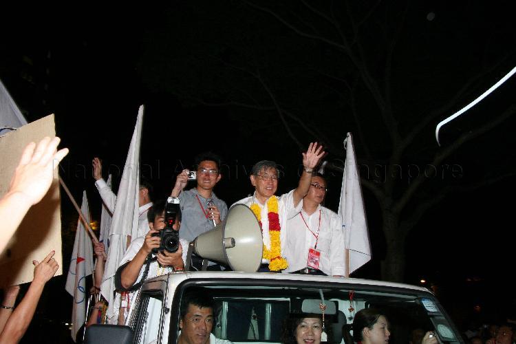 Singapore Democratic Alliance (SDA) candidate for Potong Pasir Chiam See Tong (garlanded) on a victory parade during Singapore General Election