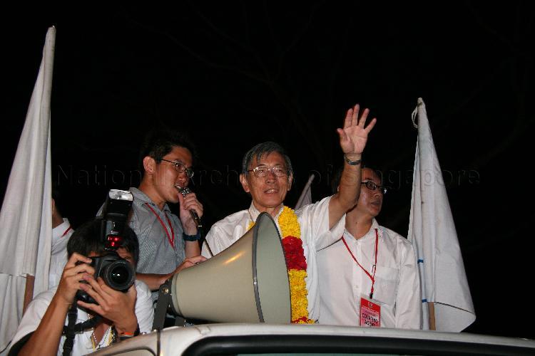 Singapore Democratic Alliance (SDA) candidate for Potong Pasir Chiam See Tong (garlanded) on a victory parade during Singapore General Election