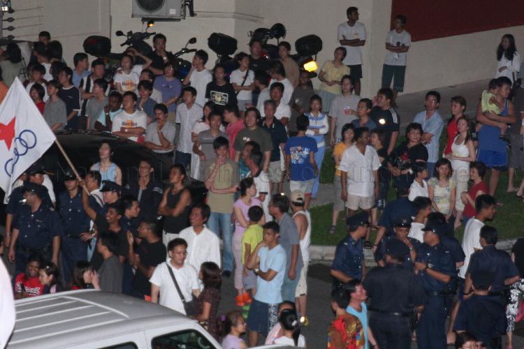 Singapore Democratic Alliance (SDA) supporters and onlookers gathering outside Jin Biao Coffeeshop at Block 136, Potong Pasir Avenue 3. The coffeeshop was assembly centre for SDA and their supporters while waiting for election results during Singapore General Election.