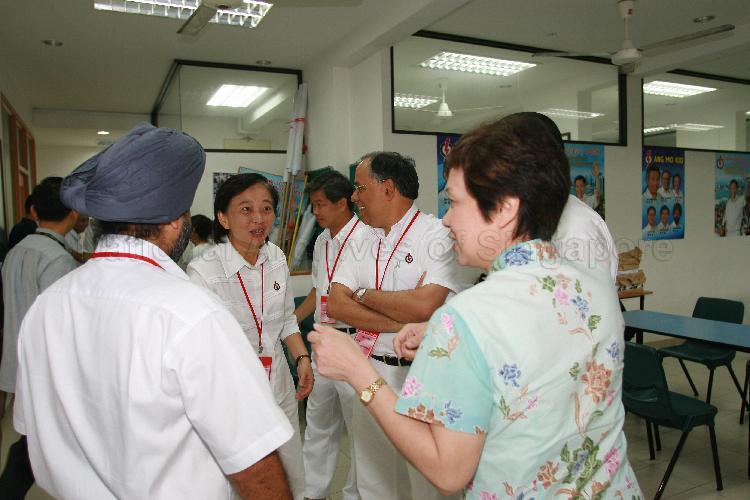People's Action Party (PAP) candidates for Ang Mo Kio Group Representation Constituency (GRC), clockwise from left, Inderjit Singh (back to camera), Ms Lee Bee Wah, Wee Siew Kim and Dr Balaji Sadasivan with Madam Ho Ching, wife of PAP candidate for Ang Mo Kio GRC and Secretary-General Lee Hsien Loong, at a polling station. PAP Secretary-General Lee Hsien Loong was visiting Ang Mo Kio GRC polling stations during Singapore General Election.