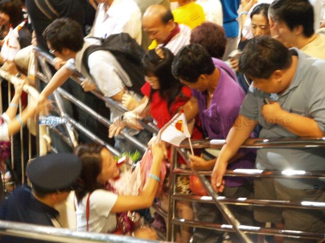 Workers' Party (WP) candidate for Aljunied Group Representation Constituency (GRC) Ms Sylvia Lim Swee Lian (garlanded) greeting supporters at Yio Chu Kang stadium, the assembly centre for WP and their supporters during Singapore General Election