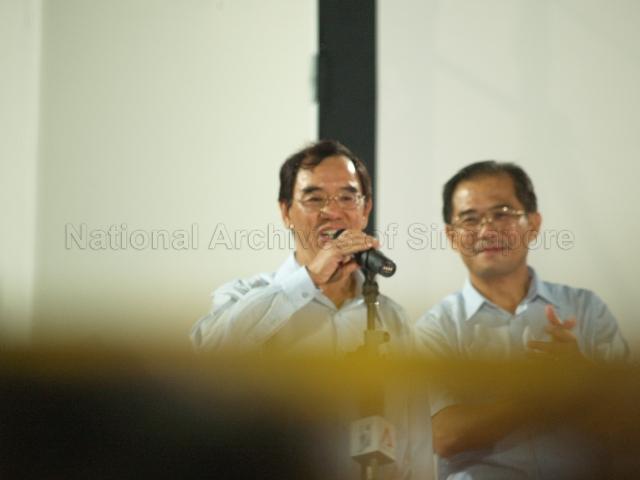 Workers' Party (WP) candidate for Joo Chiat Dr Tan Bin Seng (left) making an address at Yio Chu Kang stadium, the assembly centre for WP and their supporters during Singapore General Election