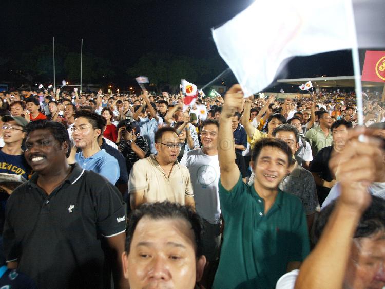Workers' Party (WP) supporters in jubilant mood at Yio Chu Kang stadium, the assembly centre for WP and their supporters while waiting for election results during Singapore General Election