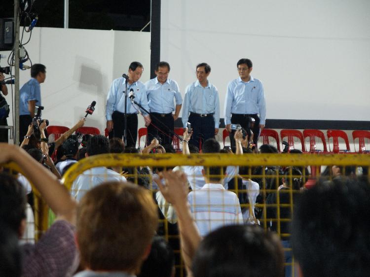 Workers' Party (WP) candidates for four single member constituencies (SMCs), from left, Low Thia Khiang of Hougang, Dr Poh Lee Guan of Nee Soon East, Dr Tan Bin Seng of Joo Chiat and Lian Chin Way of Nee Soon Central on the stage to address supporters at Yio Chin Kang stadium. The stadium was assembly centre for WP and their supporters while waiting for election results during Singapore General Election.
