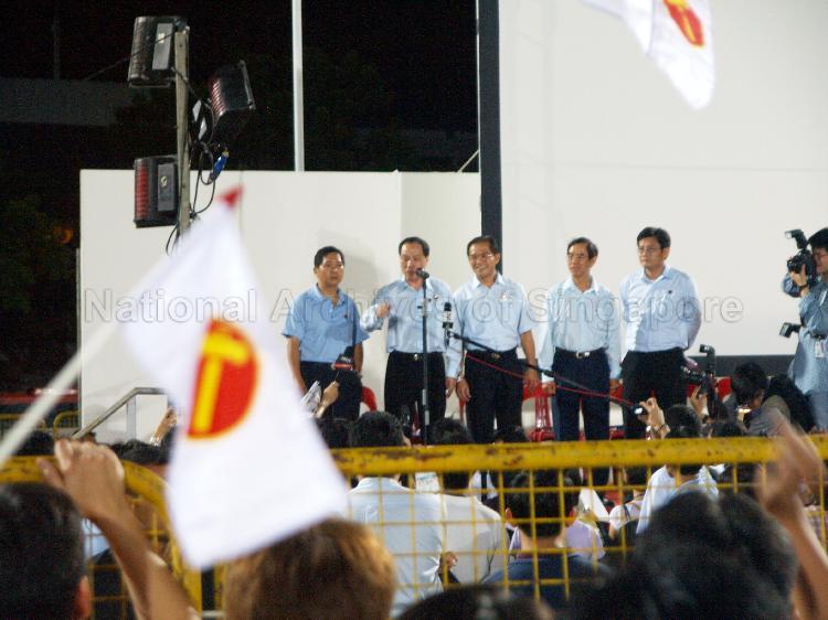 Workers' Party (WP) candidate for Hougang Low Thia Khiang (second from left) addressing supporters at Yio Chu Kang stadium with other WP candidates looking on. The stadium was assembly centre for WP and their supporters while waiting for election results during Singapore General Election.