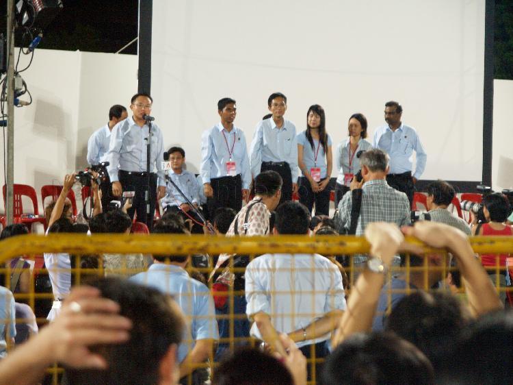 Workers' Party (WP) candidate for Ang Mo Kio Representation Constituency (GRC) Yaw Shin Leong addressing supporters at Yio Chu Kang stadium with his GRC team members looking on. The stadium was assembly centre for WP and their supporters while waiting for election results during Singapore General Election.