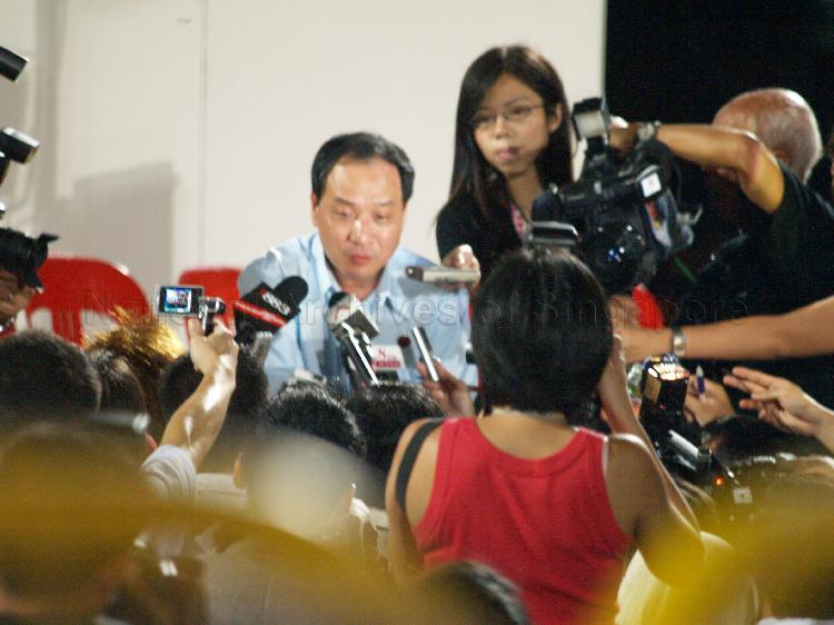 Workers' Party (WP) candidate for Hougang Low Thia Khiang being interviewed by the media at Yio Chu Kang stadium, the assembly centre for WP and their supporters while waiting for election results during Singapore General Election