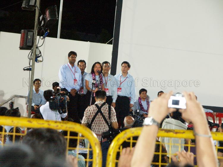 Workers' Party (WP) candidate for Aljunied Group Representation Constituency (GRC) Ms Sylvia Lim Swee Lian addressing supporters at Yio Chu Kang stadium with her GRC team members (from left) James Gomez, Mohammed Rahizan Bin Yaacob, Goh Meng Seng and Tan Wui Hua looking on. The stadium was assembly centre for WP and their supporters while waiting for election results during Singapore General Election.