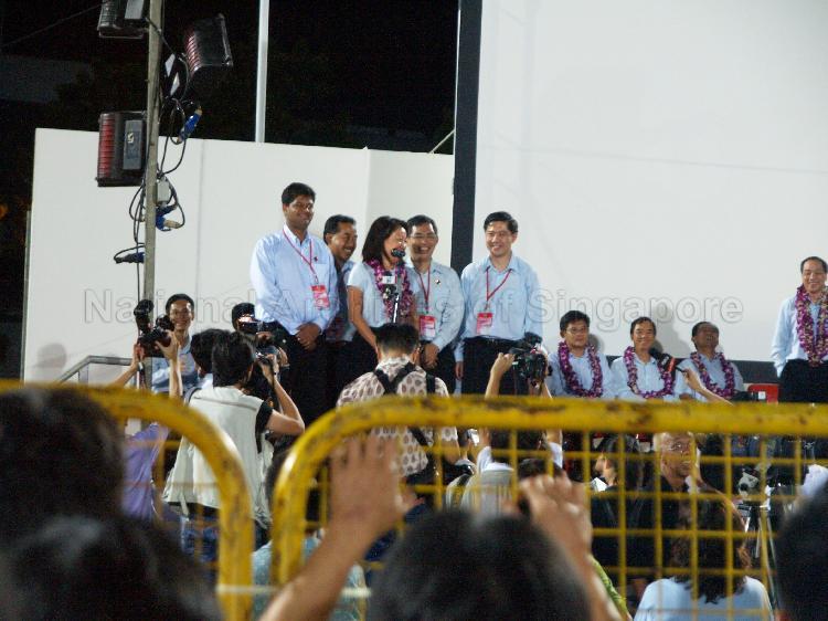 Workers' Party (WP) candidates for Aljunied Group Representation Constituency (GRC), from left, James Gomez, Mohammed Rahizan Bin Yaacob, Ms Sylvia Lim Swee Lian, Goh Meng Seng and Tan Wui Hua on the stage to address supporters at Yio Chu Kang stadium, the assembly centre for WP and their supporters while waiting for election results during Singapore General Election