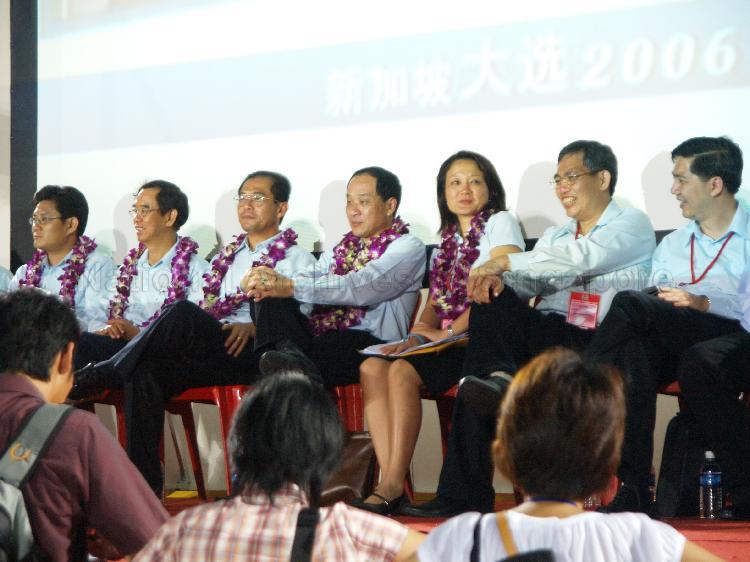 Workers' Party (WP) candidates (from left) Lian Chin Way of Nee Soon Central, Dr Tan Bin Seng of Joo Chiat, Dr Poh Lee Guan of Nee Soon East, Low Thia Khiang of Hougang, Ms Sylvia Lim Swee Lian of Aljunied Group Representation Constituency (GRC), Goh Meng Seng of Aljunied GRC and Tan Wui Hua of Aljunied GRC at Yio Chu Kang stadium, the assembly centre for WP and their supporters while waiting for election results during Singapore General Election