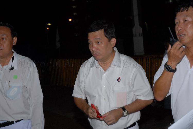People's Action Party (PAP) candidate for Potong Pasir Seetoh Yih Pin (centre) at Serangoon stadium, the assembly centre for PAP and their supporters during Singapore General Election