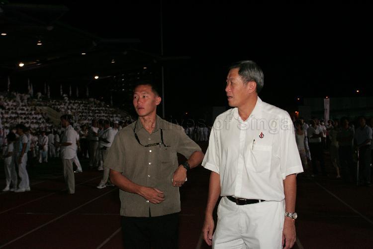 People's Action Party (PAP) candidate for Bishan-Toa Payoh Group Representation Constituency (GRC) Dr Ng Eng Hen (right) at Serangoon stadium, the assembly centre for PAP and their supporters during Singapore General Election