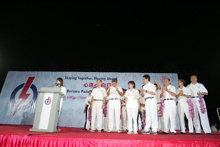 People's Action Party (PAP) candidates for Jalan Besar Group Representation Constituency (GRC), from left, Dr Lily Neo, Dr Lee Boon Yang, Dr Yaacob Ibrahim, Ms Denise Phua Lay Peng and Heng Chee How on the stage at Serangoon stadium to address supporters after their victory during Singapore General Election. The stadium was assembly centre for PAP and their supporters.