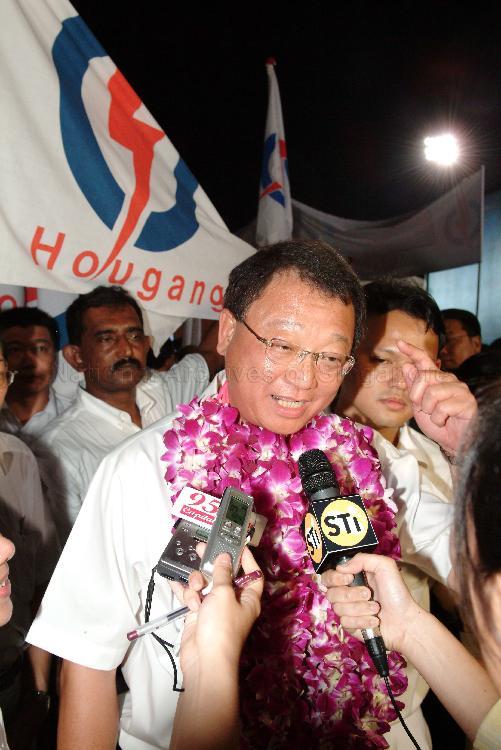 People's Action Party (PAP) candidate for Hougang Eric Low Siak Meng speaking to the media at Serangoon stadium, the assembly centre for PAP and their supporters during Singapore General Election