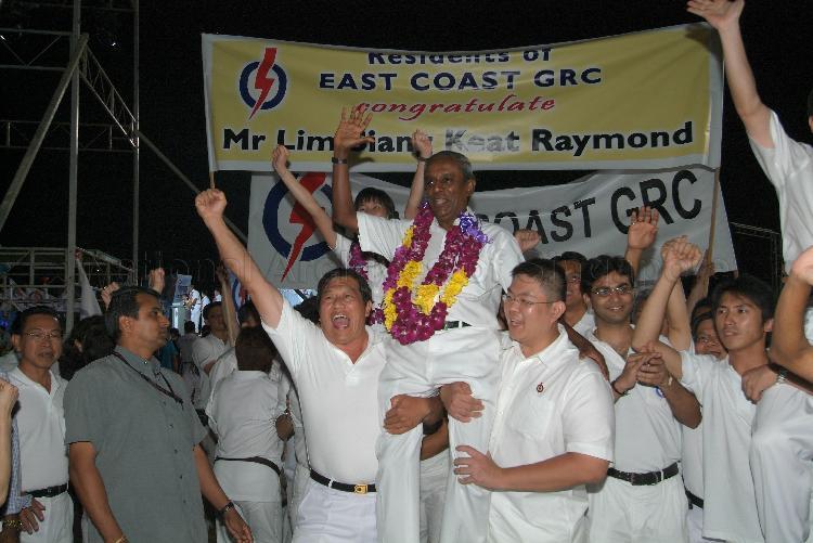 People's Action Party (PAP) candidate for East Coast Group Representation Constituency (GRC) Professor S Jayakumar being chaired by supporters at Serangoon stadium after his victory during Singapore General Election. The stadium was assembly centre for PAP and their supporters.