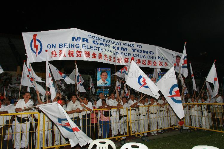 Supporters displaying congratulatory banner on People's Action Party (PAP) candidate Gan Kim Yong being elected as Member of Parliament for Chua Chu Kang at Woodlands stadium, the assembly centre for PAP and their supporters during Singapore General Election