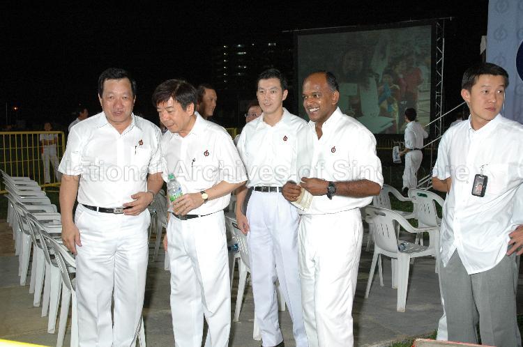 People's Action Party (PAP) candidates for Sembawang Group Representation Constituency (GRC) Shanmugam Kasiviswanathan (second from right), Dr Lim Wee Kiak and Khaw Boon Wan with elected PAP Member of Parliament for Hong Kah GRC Ang Mong Seng (left) at Woodlands stadium, the assembly centre for PAP and their supporters during Singapore General Election