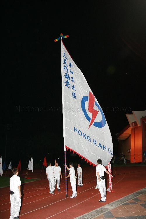 Supporters displaying giant People's Action Party (PAP) flag for Hong Kah Group Representation Constituency (GRC) at Woodlands stadium, the assembly centre for PAP and their supporters during Singapore General Election