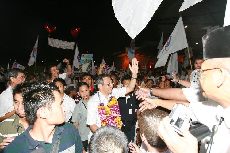 People's Action Party (PAP) candidate for Ang Mo Kio Group Representation Constituency (GRC) Lee Hsien Loong (garlanded) greeting supporters at Woodlands stadium after his victory during Singapore General Election