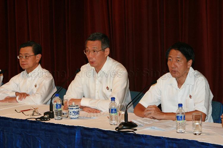 Elected People's Action Party (PAP) Member of Parliament (MP) for Ang Mo Kio Group Representation Constituency (GRC) Lee Hsien Loong (centre) speaking at post-election press conference while MP-elect for Pasir Ris-Punggol GRC Teo Chee Hean (right) and MP-elect for Bishan-Toa Payoh GRC Wong Kan Seng look on. The press conference was held at Treasury Building.