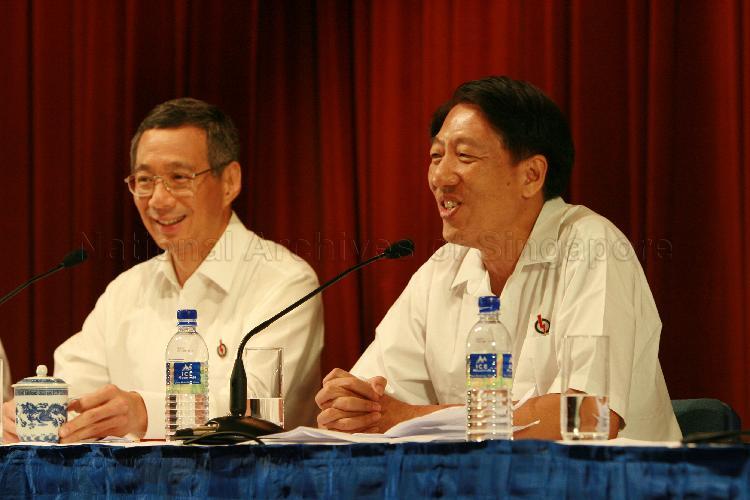 Elected People's Action Party (PAP) Member of Parliament (MP) for Pasir Ris-Punggol Group Representation Constituency (GRC) Teo Chee Hean (right) speaking at post-election press conference while MP-elect for Ang Mo Kio GRC Lee Hsien Loong looks on. The press conference was held at Treasury Building.