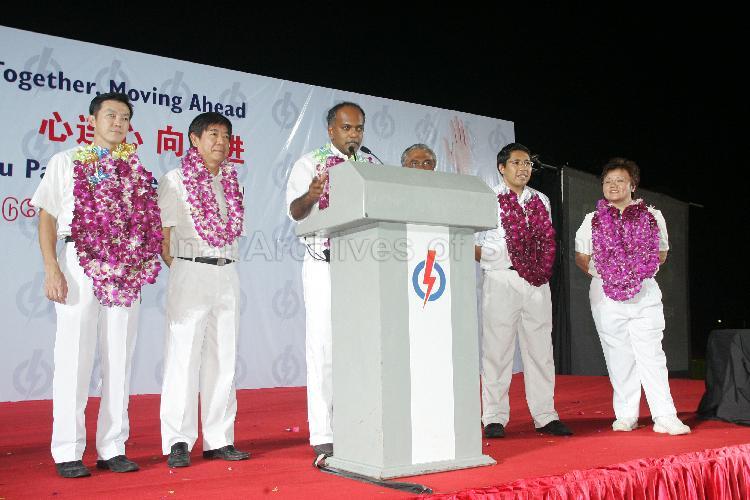 People's Action Party (PAP) candidates for Sembawang Group Representation Constituency (GRC), from left, Dr Lim Wee Kiak, Khaw Boon Wan, Shanmugan Kasiviswanathan, Dr Mohamad Maliki bin Osman and Ms Ellen Lee Geck Hoon on the stage at Woodlands stadium to address supporters after their victory during Singapore General Election. The stadium was assembly centre for PAP and their supporters.