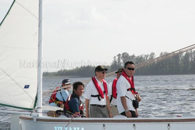 Prime Minister (PM) Lee Hsien Loong, Director of Outward Bound Singapore (OBS) Nicholas Conceicao (second from right) and others going from OBS Camp 2 to Camp 1 by sailboat in Pulau Ubin, during PM Lee's visit to OBS to celebrate its 40th anniversary