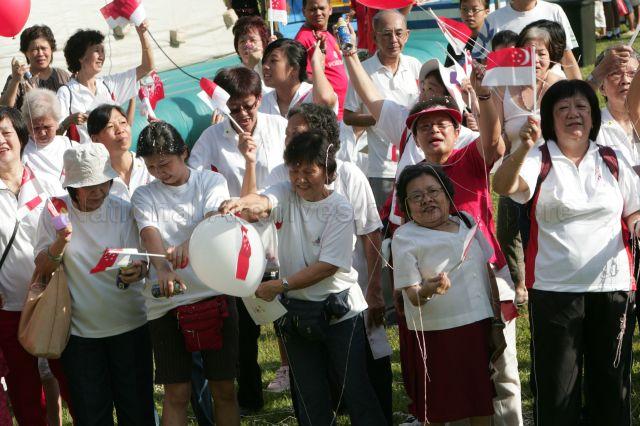 Residents waving Singapore flags and participating happily in the National Day carnival and celebrations for Ang Mo Kio Group Representation Constituency and Yio Chu Kang which was attended by Guest of Honour Prime Minister Lee Hsien Loong