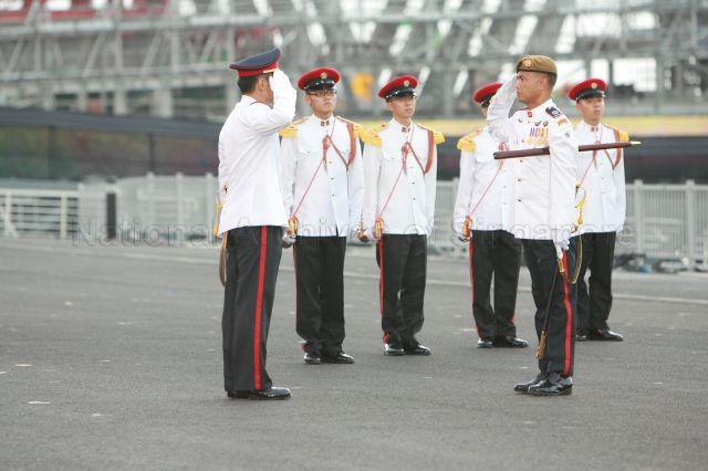 National Day Parade 2008 at Marina Bay - Parade Regimental Sergeant Major Master Warrant Officer Shamsuddin Bin Isnin (right) handing the command over to Parade Commander Lieutenant-Colonel Mark Teo Cheng Hai