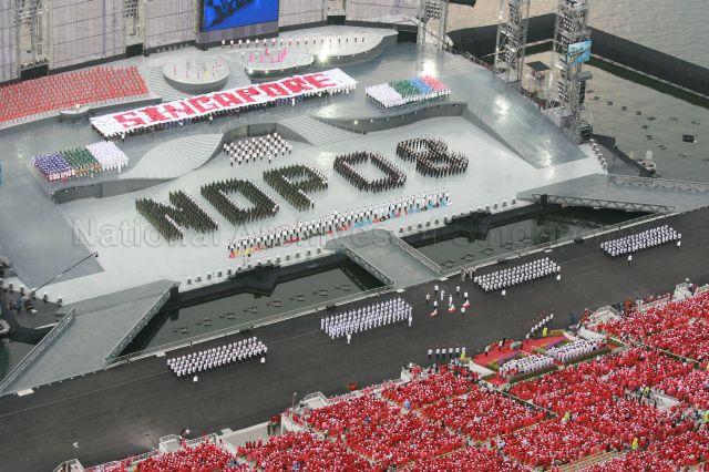 National Day Parade 2008 at Marina Bay - Aerial view of spectator stands and floating platform with the phrase 'NDP 08' formed by contingents