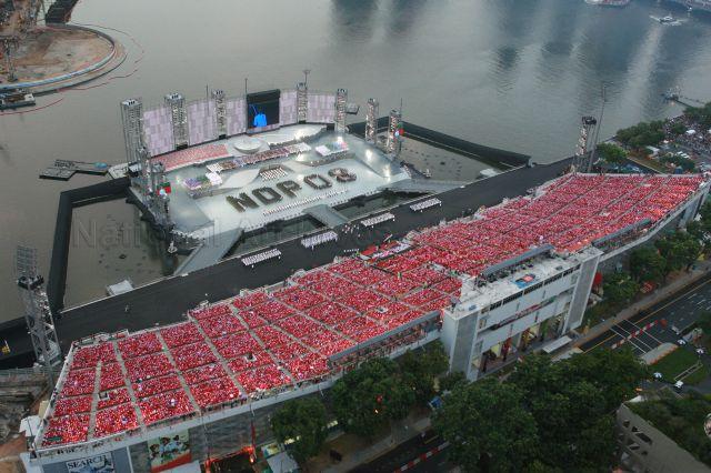 National Day Parade 2008 at Marina Bay - Aerial view of spectator stands and floating platform with the phrase 'NDP 08' formed by contingents