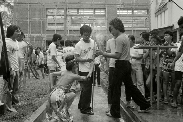 Medium possessed by the deity Sun Wo Kong, in temple procession at Redhill