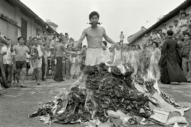 Leng Hiang Tua's mediums led by Ah Hui, who is possessed by Tiong Twa the third prince, at the deity's birthday celebration at Clarke Quay