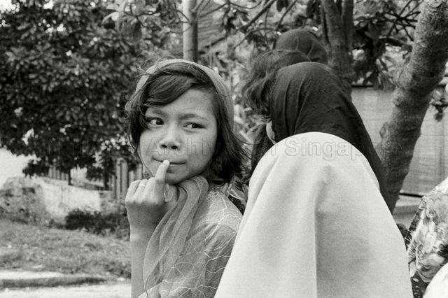 Close-up of young Malay women in traditional costume at Changi