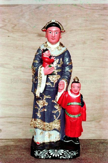 Work of deity carver Ng Say Tian at Club Street - Carving of one of the 12 Spiritual Nannies, also known as Shi Er (twelve) Po Jie or Shi Er (twelve) Nai Niang who are the assistants of Zhu Sheng Niang Niang, the Goddess of Birth