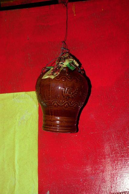 Evil spirit trapped in jar sealed by a talisman after an exorcism to be thrown in the sea