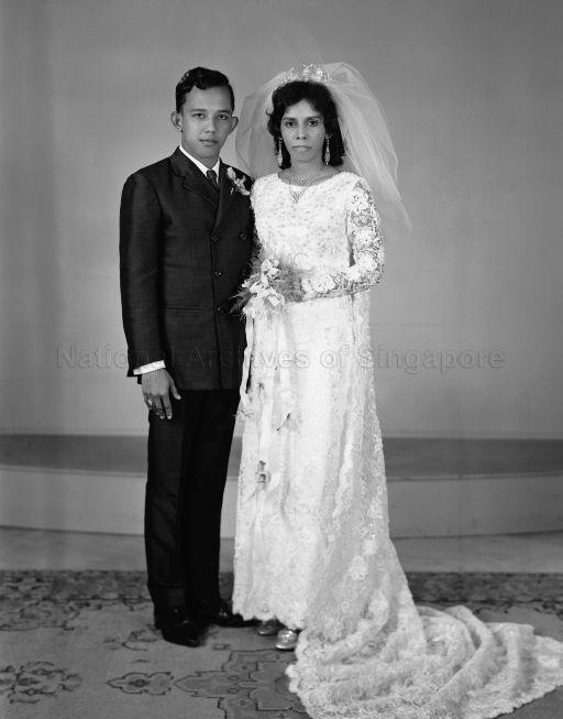 Full length portrait of bride and groom