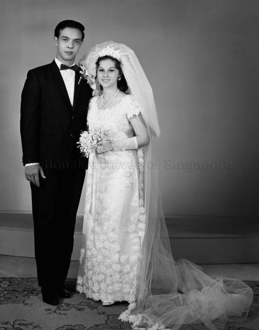 Full length portrait of bride and groom