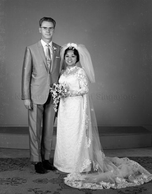 Full length portrait of bride and groom
