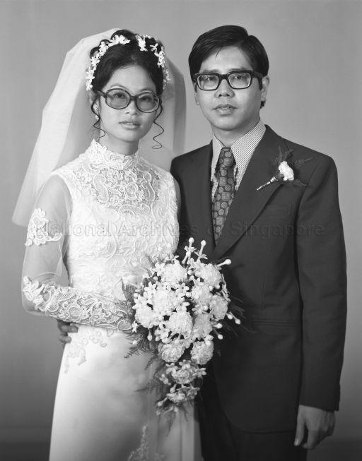 Three-quarter length portrait of bride and groom