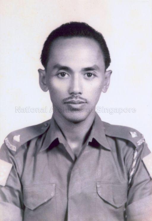 Photo of a young Mahmud Bin Awang, who was a leading trade unionist of the National Trade Union Congress (NTUC) and a People's Action Party (PAP) Member of Parliament. He was dressed in the People's Defence Force (PDF) Temasek green uniform, which was later used by the Singapore Armed Forces before a new uniform was introduced in the mid-1980s. Together with other leading PAP Members of Parliament such as Fong Sip Chee, Ong Pang Boon, Chan Chee Seng, Othman Work and Jek Yeun Thong, Mahmud Bin Awang was a volunteer in the PDF. Following Singapore's separation from Malaysia on 9 August 1965, defence of Singapore was in the hands of only 2 regular infantry battalions and a small number of military volunteers. This led to the call made by Prime Minister Lee Kuan Yew in December 1965, to volunteer in contributing to Singapore's defence. The PDF consisted of volunteers, with the first batch of officer cadets comprising of cabinet ministers and PAP Members of Parliament. After 3 months of training beginning in January 1966, these volunteers were commissioned as officers, holding a minimum rank of Second-Lieutenant.