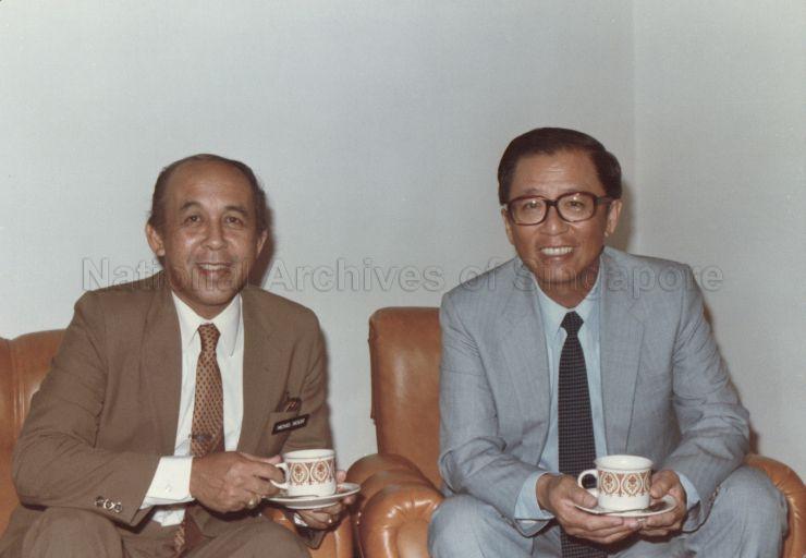 Malaysian official Mohd Noor (left) and Chairman of Public Utilities Board Lee Ek Tieng having refreshments after signing of agreement