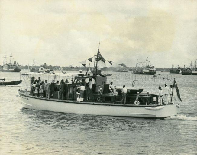 View of the Master Attendant's vessel "Tekong" in which Yang Di-Pertuan Negara Yusof Ishak and his family enjoyed the water carnival held for Loyalty Week celebrations
