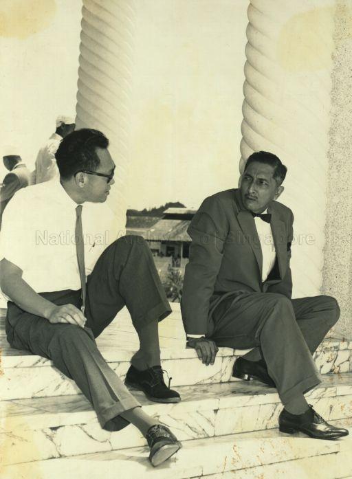 Yang Di-Pertuan Negara Yusof Ishak and Prime Minister Lee Kuan Yew removing their shoes before entering the Brunei mosque