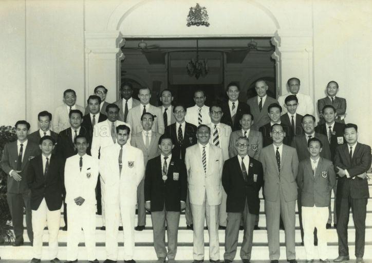 Yang Di-Pertuan Negara Yusof Ishak in a group photo with Committee Members of Singapore Olympic and Sports Council (SOSC) and Council Members of the Singapore Amateur Weight-Lifting Federation, at tea party at the Istana Negara in honour of Tan Howe Liang (on His Excellency's right), silver medalist for weight-lifting at the 1960 Olympic Games in Rome and Singapore's first Olympics medalist. Also in the photo are Chua Tian Teck, Manager and Chef De Mission of the Singapore team, and C C Tan, President of SOSC, (front row, fourth and third from right, respectively).