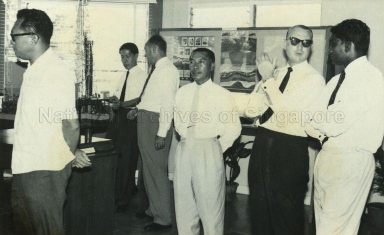 Prime Minister Lee Kuan Yew (left) and Personal Secretary (Political) at Prime Minister's Office Jek Yeun Thong (furthest from camera), at the Brunei Shell Petroleum Company Museum