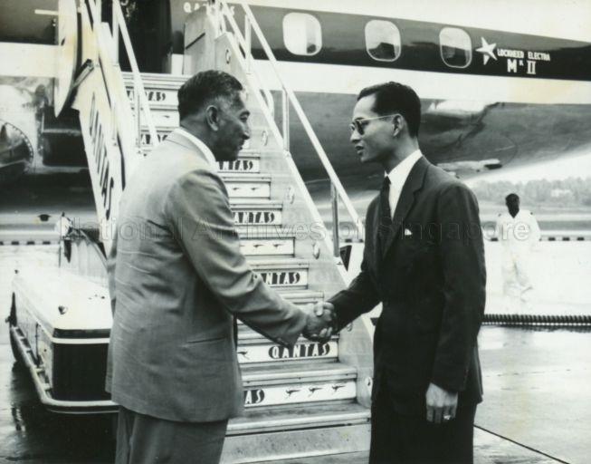 Yang Di-Pertuan Negara Yusof Ishak greeting King Bhumibol of Thailand at Singapore Airport during the King's stopover en route to Australia and New Zealand