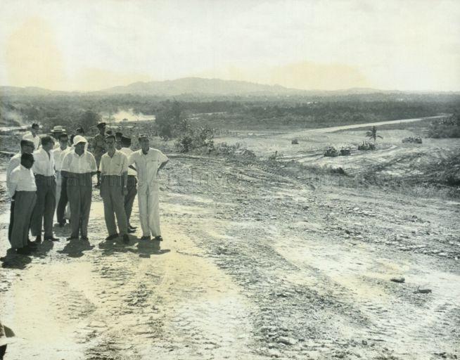 Yang Di-Pertuan Negara Yusof Ishak (with white hat), accompanied by Chairman of the Economic Development Board Hon Sui Sen (second from right), touring the Jurong industrial site as part of his visit to various departments of the Ministry of Finance