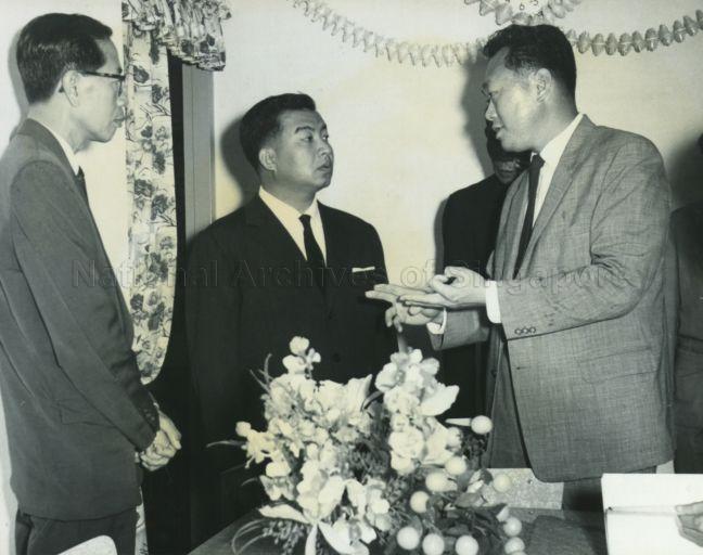Prime Minister Lee Kuan Yew speaking with Prince Norodom Sihanouk of Cambodia during the Prince's tour of housing estates in Singapore