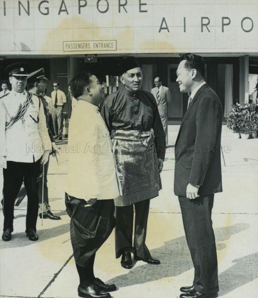 Prince Norodom Sihanouk of Cambodia chatting with Yang Di-Pertuan Negara Yusof Ishak and Prime Minister Lee Kuan Yew at Singapore International Airport before his departure